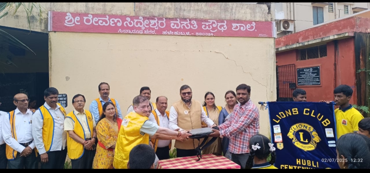 Donation of laptop to school.