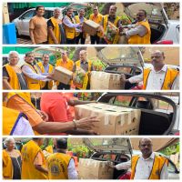 Handing over old clothes to the needy