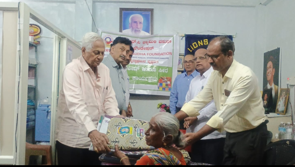Distribution of bed sheets and sarees to old age home