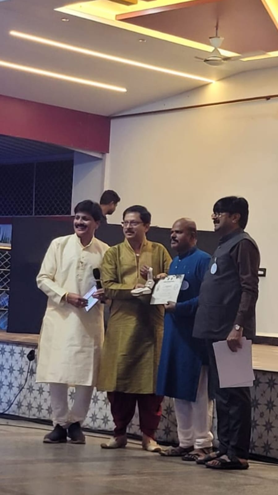 DISTRICT CHAIRPERSON FROM OUR CLUB HOSTING AN EVENT AND ANOUNCING PRIZE.