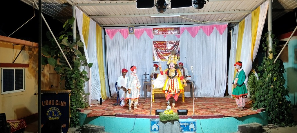 CONDUCTING YAKSHAGANA CULTURAL ACTIVITY UNDER COMMUNITY AWARENESS.