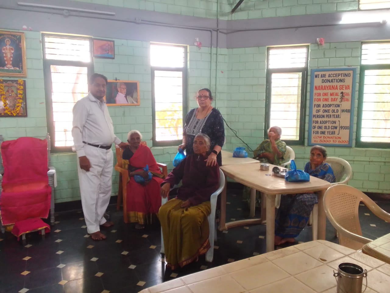 Distributing groceries and fruits to inmates of Old age home. 