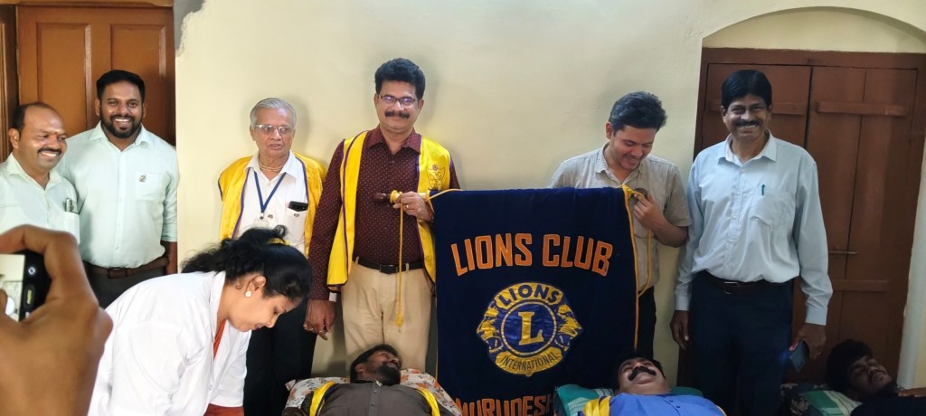 CONDUCTING BLOOD DONATION CAMP.