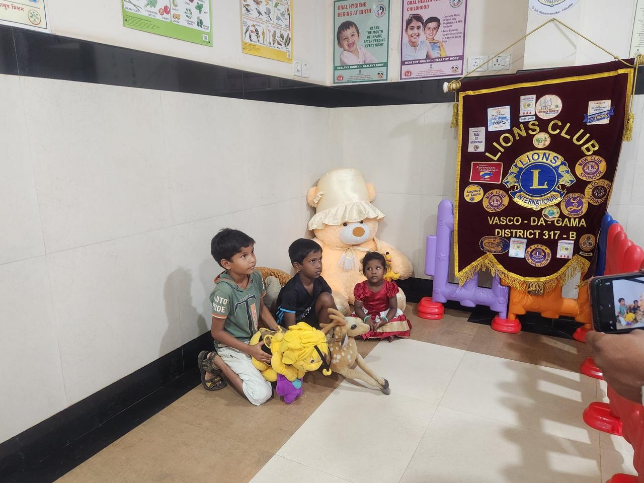 Bring a smile- handing over soft toys in Paediatric ward