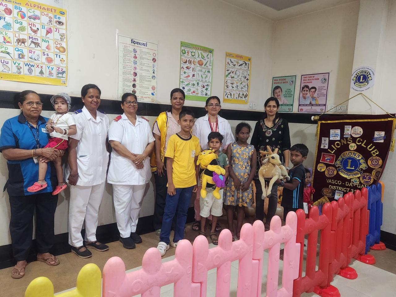 Bring a smile- handing over soft toys in Paediatric ward